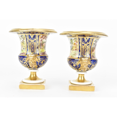 11 - A pair of early 19th century Masons 'Campana' shape bone china vases, circa 1810-15, each painted wi... 