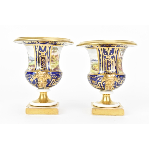 11 - A pair of early 19th century Masons 'Campana' shape bone china vases, circa 1810-15, each painted wi... 