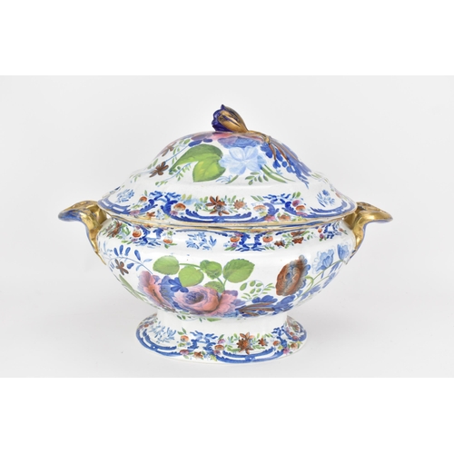 14 - An early 19th century tureen and stand, circa 1820, transfer-printed in underglaze blue and overpain... 