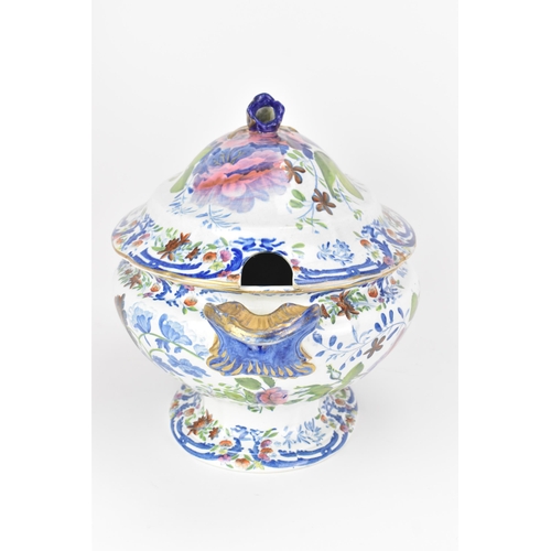 14 - An early 19th century tureen and stand, circa 1820, transfer-printed in underglaze blue and overpain... 