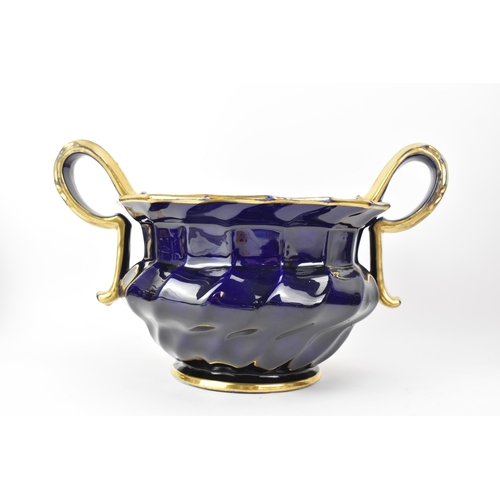 24 - An early 19th century Masons pot-pourri vase, circa 1820-25, with mazarine-blue ground, painted in a... 