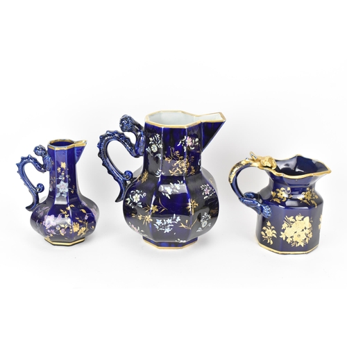 28 - Three early 19th century Masons jugs, with mazarine-blue ground, painted in an oriental style with f... 