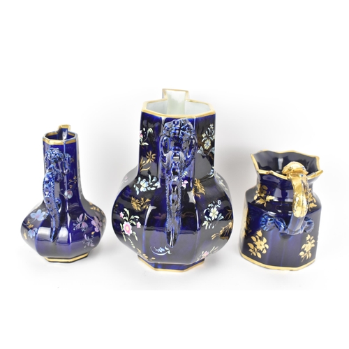 28 - Three early 19th century Masons jugs, with mazarine-blue ground, painted in an oriental style with f... 