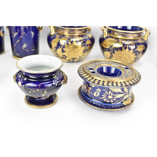 29 - A selection of early 19th century Masons ware, each with mazarine-blue ground, painted in an orienta... 