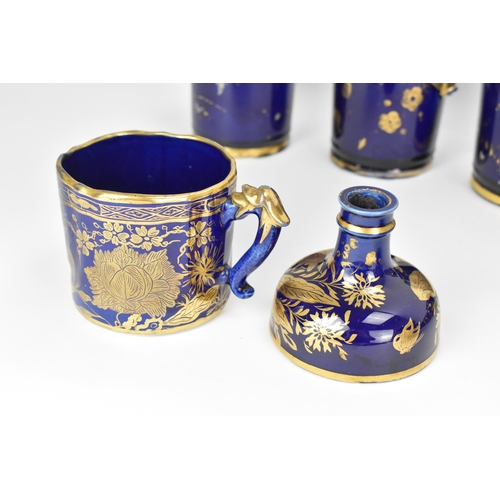 29 - A selection of early 19th century Masons ware, each with mazarine-blue ground, painted in an orienta... 