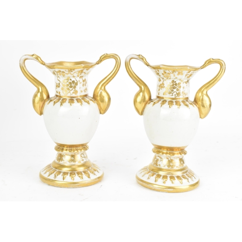 3 - An early 19th century Masons garniture of three ironstone vases, each with elaborate moulded handles... 