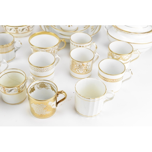 40 - A selection of early 19th century Masons ware, each on white glazed grounds decorated in gilt mainly... 