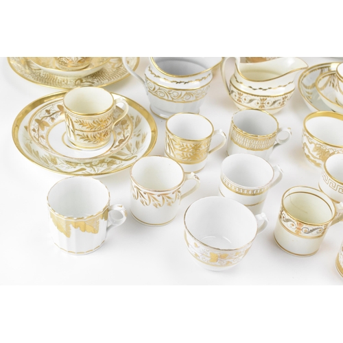 40 - A selection of early 19th century Masons ware, each on white glazed grounds decorated in gilt mainly... 