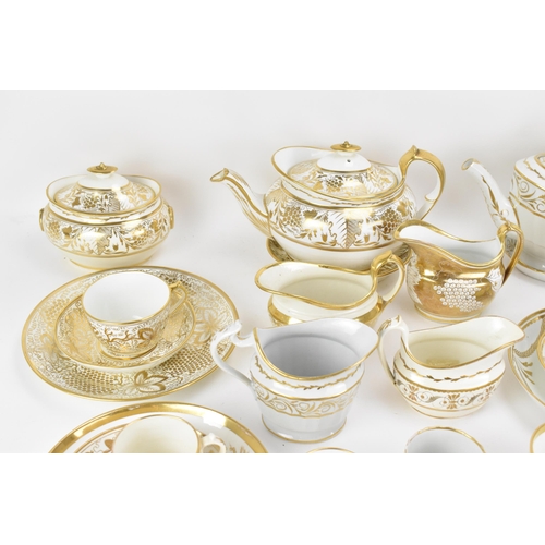 40 - A selection of early 19th century Masons ware, each on white glazed grounds decorated in gilt mainly... 