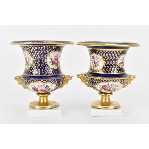 42 - A pair of early 19th century Masons bone china vases, circa 1810-12, of campagna form painted in cob... 