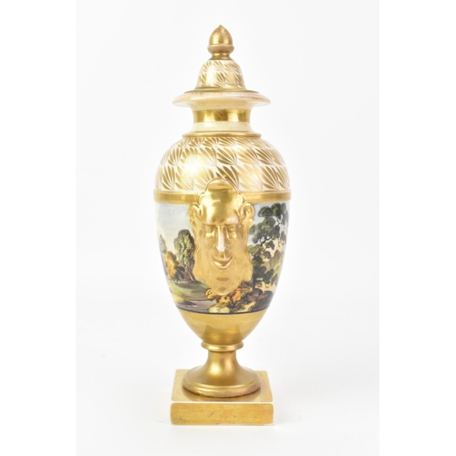 44 - An early 19th century Masons lidded vase, the centre hand-painted depicting a continuous landscape s... 