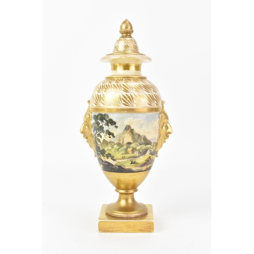 44 - An early 19th century Masons lidded vase, the centre hand-painted depicting a continuous landscape s... 