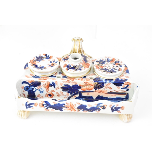 57 - Two 19th century Masons inkwells, to include one on a cobalt blue ground with panels of flowers, two... 