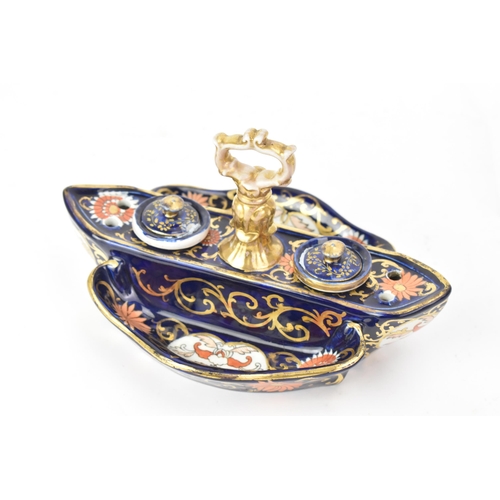 57 - Two 19th century Masons inkwells, to include one on a cobalt blue ground with panels of flowers, two... 