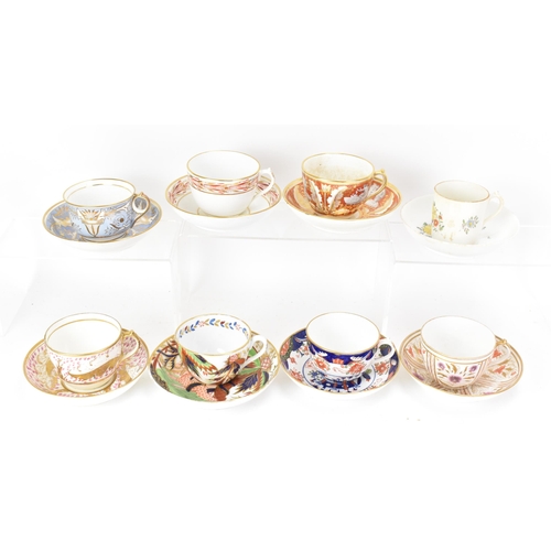 61 - A selection of eight 19th century Masons cups and saucers, to include one set in painted with a palm... 