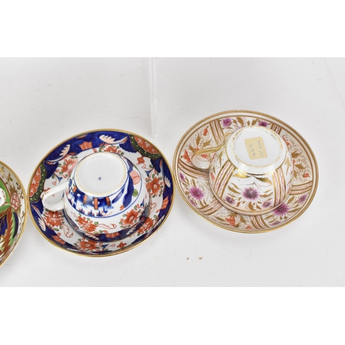 61 - A selection of eight 19th century Masons cups and saucers, to include one set in painted with a palm... 