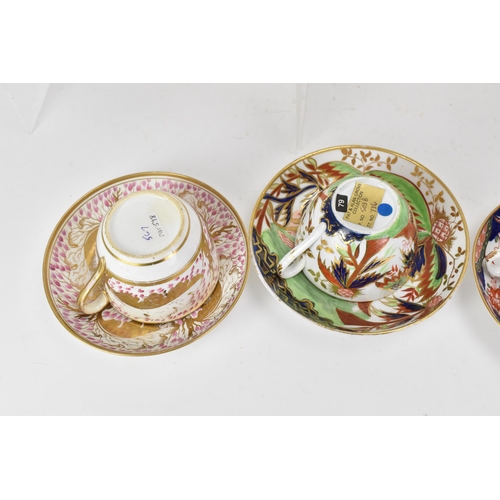 61 - A selection of eight 19th century Masons cups and saucers, to include one set in painted with a palm... 