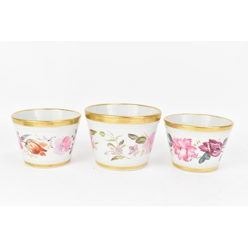 69 - An early 19th century Masons garniture of three ironstone flower-pots and stands, each hand-painted ... 