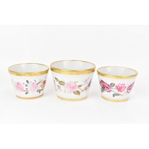 69 - An early 19th century Masons garniture of three ironstone flower-pots and stands, each hand-painted ... 