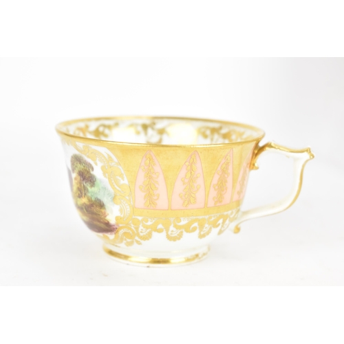 94 - An early 19th century Derby porcelain cup and saucer, circa 1810-20, each decorated with landscape s... 