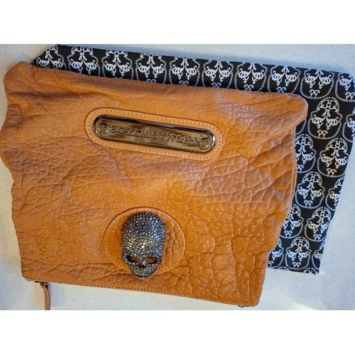 20 - Thomas Wylde- A Skull studded fold-over clutch bag, crafted from brown crinkled leather, approx 28cm... 