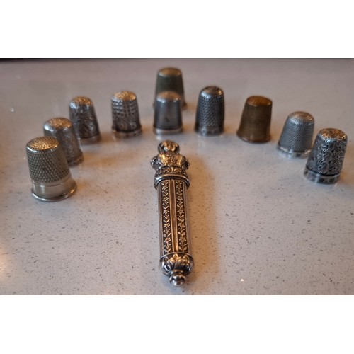 51 - An early 20th Century silver etui together with 7 silver thimbles and 3 other thimbles, weight of si... 