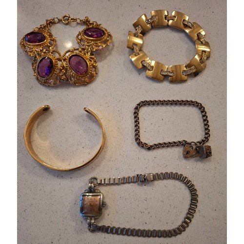 56 - Vintage costume jewellery to include paste stone brooches, a Joli Follie gold tone and purple embell... 