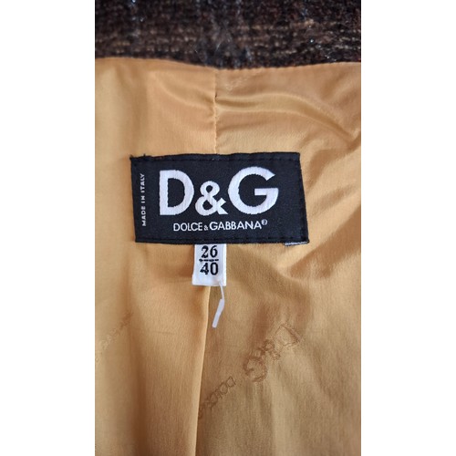 5 - Dolce & Gabbana- A brown checked woollen boucle jacket, European size 40, having a mustard coloured ... 