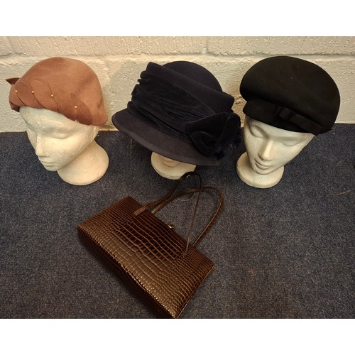 50 - A group of mid 20th Century and later hats to include a Sandra Phillipps navy felt and velvet hat, t... 