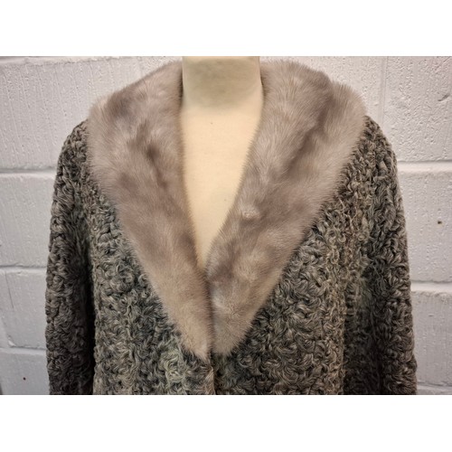 65 - A vintage Canadian grey astrakhan coat manufactured for Ogilvys of Montreal having a grey musquash c... 