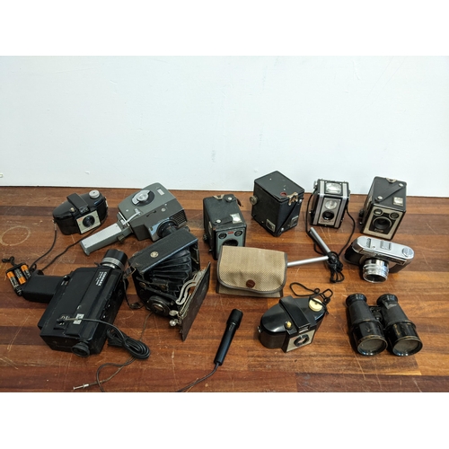 320 - A mixed lot to include photographic equipment to include Brownie, Duaflex and other cameras and Cinn... 