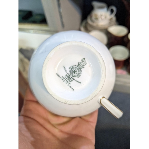 340 - A part Poole pottery coffee set, and a part Royal Doulton dinner service Arden pattern
Location: 3.3... 