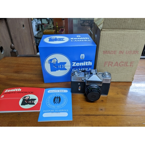 279 - A Zenit-E Mosha 80 film camera with owner's handbook, passport to service, and original box serial n... 