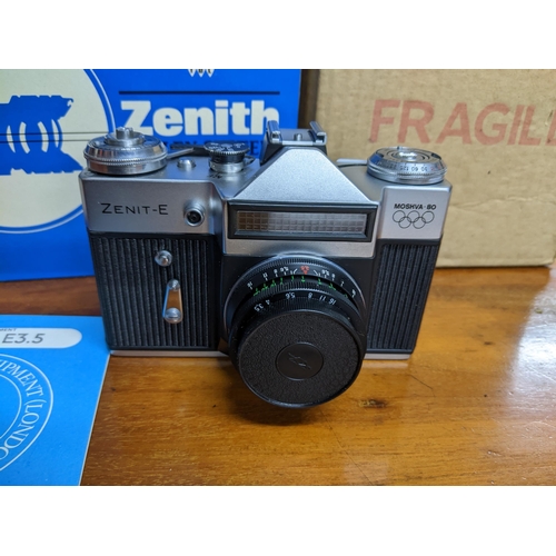 279 - A Zenit-E Mosha 80 film camera with owner's handbook, passport to service, and original box serial n... 