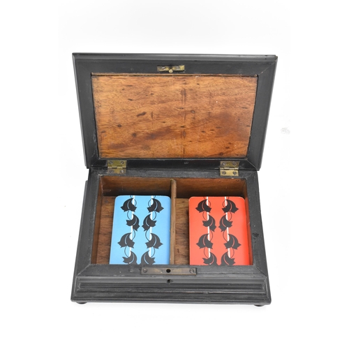 312 - A 19th century pietra dura ebonised wood games box, the rectangular top inset with a black slate pan... 