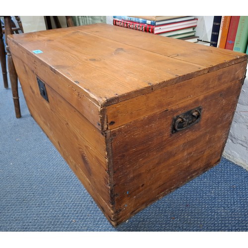 236 - A small stained pine travel trunk having wrought iron side handles. Location:RWM
If there is no cond... 