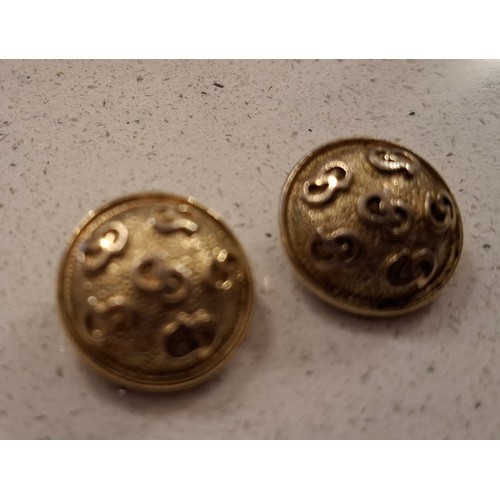 8 - Christian Dior-A pair of gold tone clip on earrings of circular form with CD monogram design. Locati... 