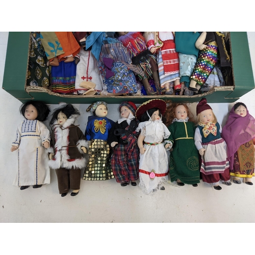 196 - A group of vintage porcelain dolls in varying forms of cultural dresses

Location: G
If there is no ... 