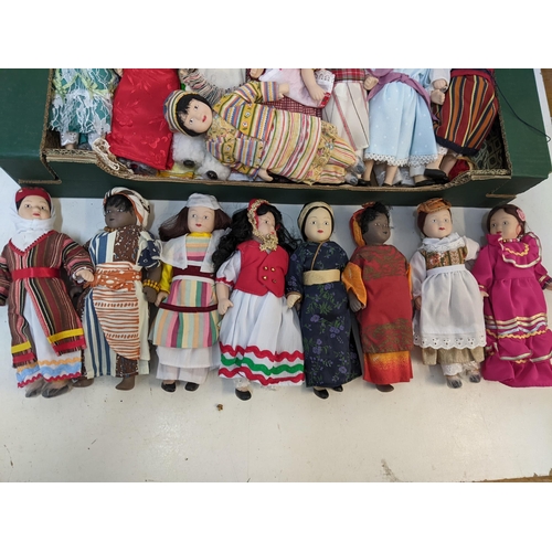 197 - A group of vintage porcelain dolls in varying forms of cultural dresses

Location: A2F
If there is n... 