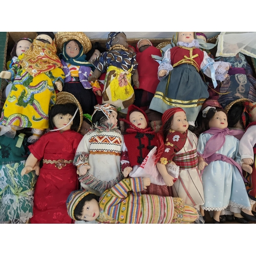 197 - A group of vintage porcelain dolls in varying forms of cultural dresses

Location: A2F
If there is n... 