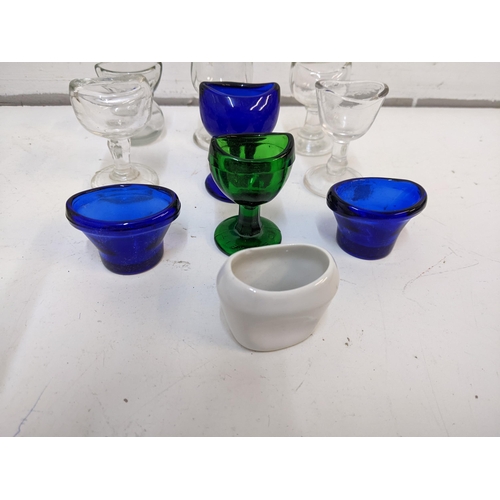 198 - A collection of Victorian eye baths to include cobalt blue examples, a ceramic example and others.

... 