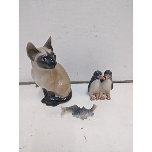 203 - Three porcelain Royal Copenhagen models to include No 3281 Siamese cat, No 2870 Minnows, No 0611 Pen... 