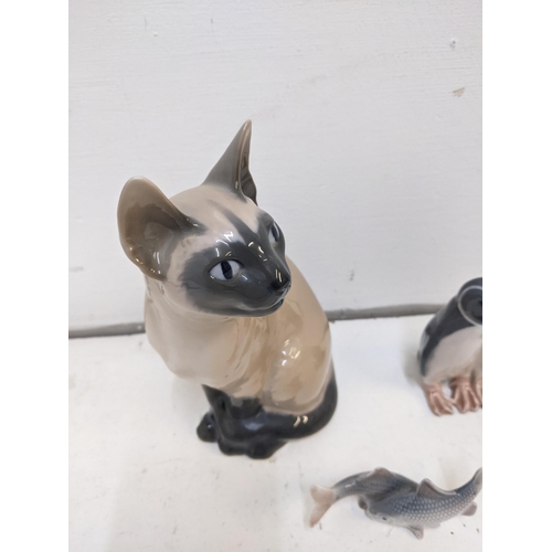 203 - Three porcelain Royal Copenhagen models to include No 3281 Siamese cat, No 2870 Minnows, No 0611 Pen... 