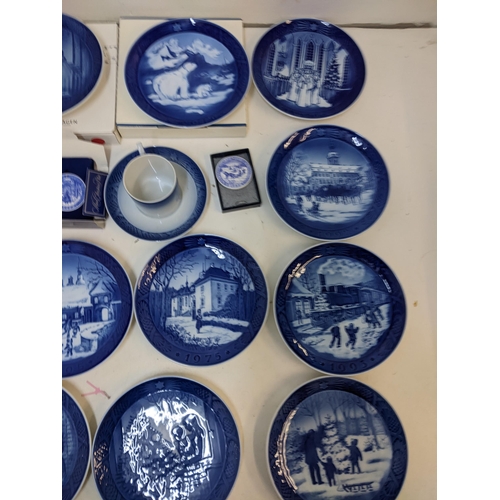 204 - A mixed lot to include Royal Copenhagen Christmas plates; plaques; a cranberry jug; glass set.

Loca... 