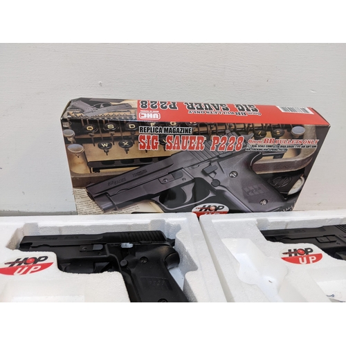 213 - A pair of SIG Saver P226 6mm BB guns along with a quantity of BB guns, shooting targets and other it... 