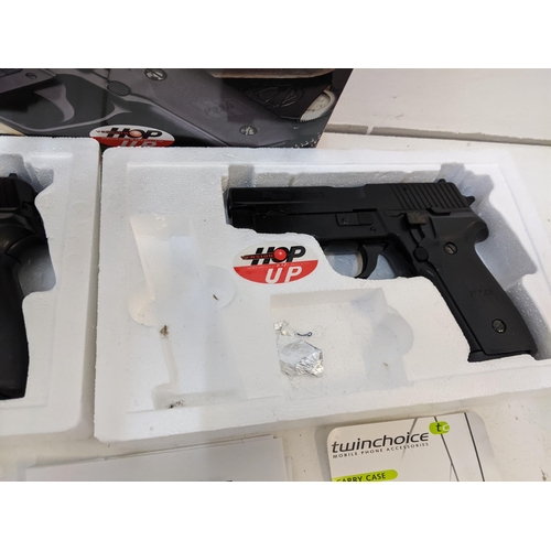 213 - A pair of SIG Saver P226 6mm BB guns along with a quantity of BB guns, shooting targets and other it... 