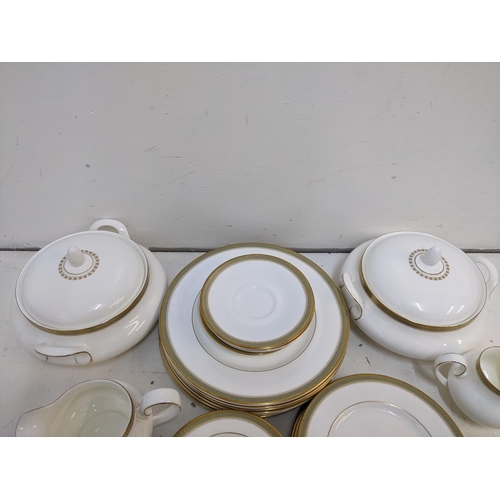 216 - A Royal Doulton Clarendon pattern part dinner service to include tureens, soup dishes, a platter and... 