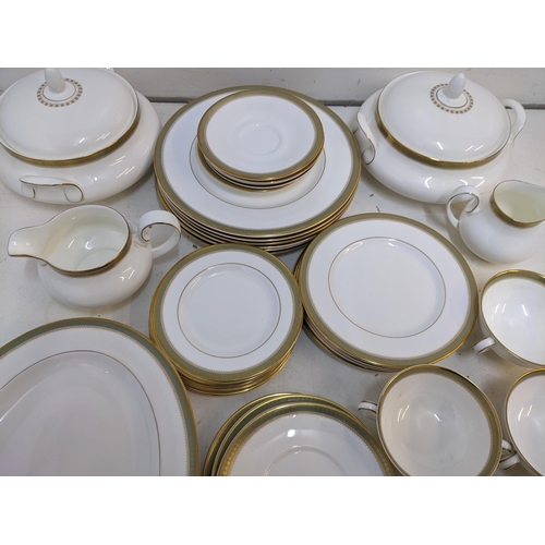 216 - A Royal Doulton Clarendon pattern part dinner service to include tureens, soup dishes, a platter and... 