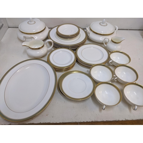 216 - A Royal Doulton Clarendon pattern part dinner service to include tureens, soup dishes, a platter and... 