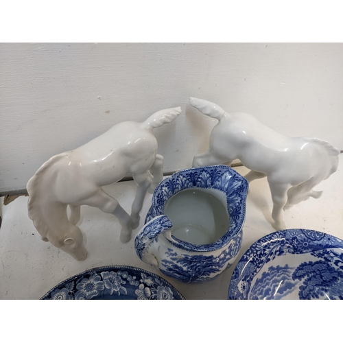 217 - A mixed lot to include two porcelain horses A/F, a late 19th century blue and white meat platter dep... 